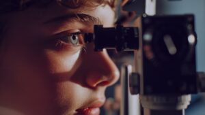 a little kid having his eye disease checkup from doctor- Treatment Options for Amblyopia (reflective error in eye) myopia in children